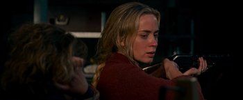 Movie still from “A Quiet Place” (2018), directed by John Krasinski – A person holding a guitar; Close Up shot, Over the shoulder angle