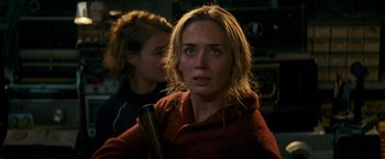 Movie still from “A Quiet Place” (2018), directed by John Krasinski – A woman holding a baseball bat in front of another woman; Close Up shot, Over the shoulder angle