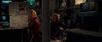 Movie still from “A Quiet Place” (2018), directed by John Krasinski – Two women are standing in a room together; Medium shot, Low angle