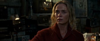 Movie still from “A Quiet Place” (2018), directed by John Krasinski – A person wearing a red jacket; Close Up shot, Over the shoulder angle