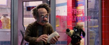 Movie still from “A Shaun the Sheep Movie: Farmageddon” (2019), directed by Will Becher – A man and a dog are standing next to each other; Medium shot, Over the shoulder angle