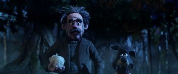 Movie still from “A Shaun the Sheep Movie: Farmageddon” (2019), directed by Will Becher – A puppet and a stuffed animal dog; Medium shot, Low angle