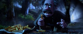 Movie still from “A Shaun the Sheep Movie: Farmageddon” (2019), directed by Will Becher – An animated character is holding a knife in his hand; Medium shot, High angle