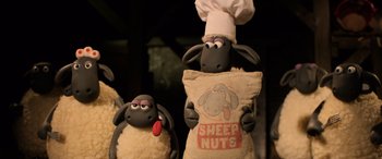 Movie still from “A Shaun the Sheep Movie: Farmageddon” (2019), directed by Will Becher – A couple of stuffed animals that are next to each other; Medium shot, Low angle