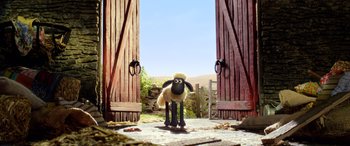 Movie still from “A Shaun the Sheep Movie: Farmageddon” (2019), directed by Will Becher – A stuffed sheep standing in front of a pair of doors; Wide shot, Low angle