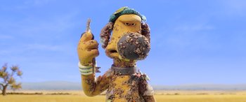 Movie still from “A Shaun the Sheep Movie: Farmageddon” (2019), directed by Will Becher – A statue of a dog holding a key; Close Up shot, Low angle