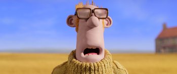 Movie still from “A Shaun the Sheep Movie: Farmageddon” (2019), directed by Will Becher – A cartoon character wearing glasses and a yellow sweater; Close Up shot, Low angle