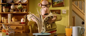 Movie still from “A Shaun the Sheep Movie: Farmageddon” (2019), directed by Will Becher – A man is reading a paper on a table; Medium shot, Low angle