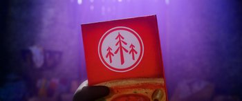 Movie still from “A Shaun the Sheep Movie: Farmageddon” (2019), directed by Will Becher – A person's hand holding a box of pizza; Extreme Close Up shot, Overhead angle