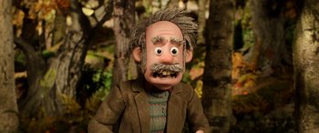 Movie still from “A Shaun the Sheep Movie: Farmageddon” (2019), directed by Will Becher – The face of a man in a suit; Close Up shot, Low angle