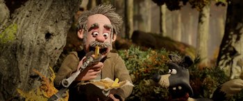 Movie still from “A Shaun the Sheep Movie: Farmageddon” (2019), directed by Will Becher – A man holding a knife and a banana peel; Close Up shot, High angle