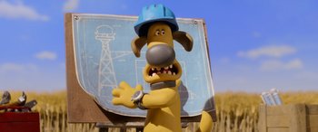 Movie still from “A Shaun the Sheep Movie: Farmageddon” (2019), directed by Will Becher – A dog wearing a blue hard hat and a watch; Medium shot, Over the shoulder angle