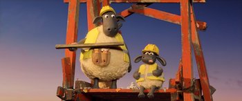 Movie still from “A Shaun the Sheep Movie: Farmageddon” (2019), directed by Will Becher – A couple of sheep are standing next to each other; Wide shot, Low angle