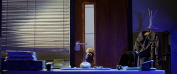 Movie still from “A Shaun the Sheep Movie: Farmageddon” (2019), directed by Will Becher – A stuffed animal in a room; Wide shot, Over the shoulder angle