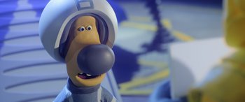 Movie still from “A Shaun the Sheep Movie: Farmageddon” (2019), directed by Will Becher – A cartoon dog wearing a space helmet; Close Up shot, Over the shoulder angle