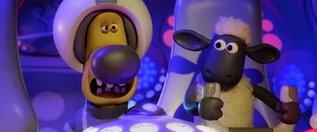Movie still from “A Shaun the Sheep Movie: Farmageddon” (2019), directed by Will Becher – A toy dog and a sheep; Close Up shot, Overhead angle