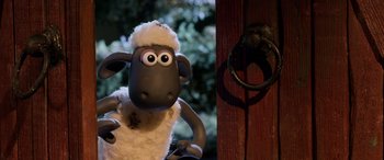 Movie still from “A Shaun the Sheep Movie: Farmageddon” (2019), directed by Will Becher – A toy sheep standing in front of a door; Close Up shot, High angle