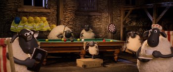 Movie still from “A Shaun the Sheep Movie: Farmageddon” (2019), directed by Will Becher – A group of sheep sitting on top of a pool table; Wide shot, High angle