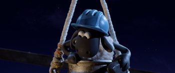 Movie still from “A Shaun the Sheep Movie: Farmageddon” (2019), directed by Will Becher – A toy sheep wearing a hard hat; Medium shot, High angle