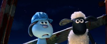 Movie still from “A Shaun the Sheep Movie: Farmageddon” (2019), directed by Will Becher – A blue dog and a white sheep are standing next to each other in front of a sky background; Medium shot, High angle
