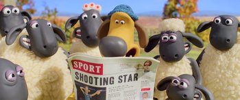 Movie still from “A Shaun the Sheep Movie: Farmageddon” (2019), directed by Will Becher – A group of sheep reading a news paper; Medium shot, High angle