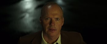 Movie still from “The Founder” (2016), directed by John Lee Hancock – A person wearing a suit and tie; Close Up shot, Low angle