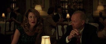 Movie still from “The Founder” (2016), directed by John Lee Hancock – A man and a woman sitting at a dinner table; Medium shot, Over the shoulder angle