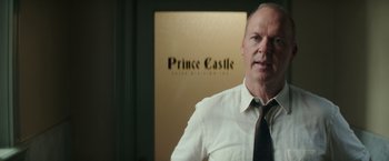 Movie still from “The Founder” (2016), directed by John Lee Hancock – A person wearing a shirt and a tie; Medium shot, Over the shoulder angle