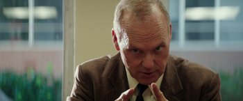 Movie still from “The Founder” (2016), directed by John Lee Hancock – An older man in a suit and tie; Close Up shot, Low angle