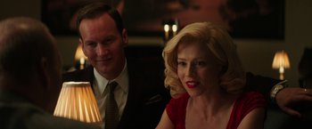 Movie still from “The Founder” (2016), directed by John Lee Hancock – A man and a woman sitting next to each other at a table; Close Up shot, Over the shoulder angle