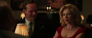 Movie still from “The Founder” (2016), directed by John Lee Hancock – A man and a woman sitting at a dinner table; Close Up shot, Over the shoulder angle