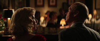 Movie still from “The Founder” (2016), directed by John Lee Hancock – A man and a woman sitting at a table talking to each other; Close Up shot, Over the shoulder angle