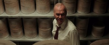 Movie still from “The Founder” (2016), directed by John Lee Hancock – A man standing in front of a shelf of ice cream; Close Up shot, High angle