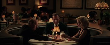Movie still from “The Founder” (2016), directed by John Lee Hancock – A group of people sitting at a table in a restaurant; Medium shot, High angle