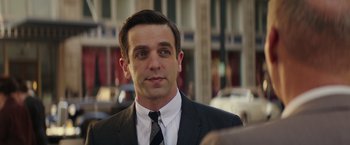 Movie still from “The Founder” (2016), directed by John Lee Hancock – A person wearing a suit and tie; Close Up shot, Over the shoulder angle