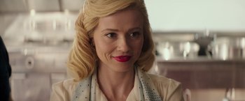 Movie still from “The Founder” (2016), directed by John Lee Hancock – A person with blonde hair wearing a white shirt; Close Up shot, Over the shoulder angle