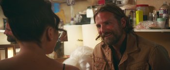 Movie still from “A Star Is Born” (2018), directed by Bradley Cooper – A man and a woman talking to each other; Close Up shot, Over the shoulder angle
