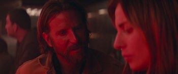 Movie still from “A Star Is Born” (2018), directed by Bradley Cooper – A man and a woman are talking in a room; Close Up shot, Over the shoulder angle