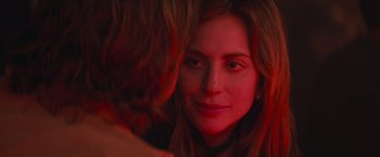 Movie still from “A Star Is Born” (2018), directed by Bradley Cooper – A person looking at a mirror; Close Up shot, Over the shoulder angle