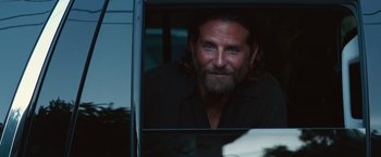 Movie still from “A Star Is Born” (2018), directed by Bradley Cooper – A person looking out of a car window; Close Up shot, Over the shoulder angle
