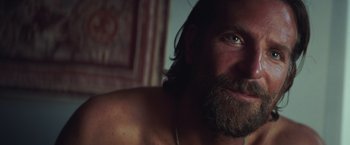 Movie still from “A Star Is Born” (2018), directed by Bradley Cooper – A person with a beard; Close Up shot, Over the shoulder angle