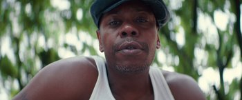 Movie still from “A Star Is Born” (2018), directed by Bradley Cooper – A person wearing a hat; Close Up shot, Low angle