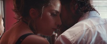 Movie still from “A Star Is Born” (2018), directed by Bradley Cooper – A woman's face and a man's face; Close Up shot, Over the shoulder angle