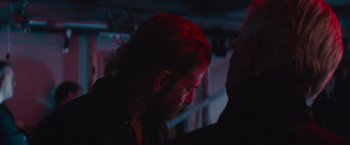 Movie still from “A Star Is Born” (2018), directed by Bradley Cooper – A person with long hair; Close Up shot, Over the shoulder angle