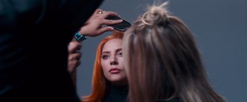 Movie still from “A Star Is Born” (2018), directed by Bradley Cooper – A woman getting her hair cut by a stylist; Close Up shot, Over the shoulder angle