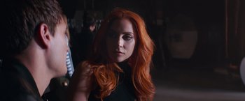 Movie still from “A Star Is Born” (2018), directed by Bradley Cooper – A beautiful woman with red hair posing for a picture; Close Up shot, Over the shoulder angle