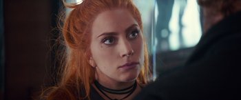 Movie still from “A Star Is Born” (2018), directed by Bradley Cooper – A person with long red hair; Close Up shot, Over the shoulder angle