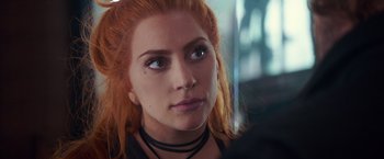 Movie still from “A Star Is Born” (2018), directed by Bradley Cooper – A person wearing a necklace; Close Up shot, Over the shoulder angle