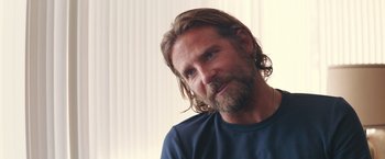 Movie still from “A Star Is Born” (2018), directed by Bradley Cooper – A person with long hair and a beard; Close Up shot, Over the shoulder angle