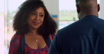 A woman that is talking to a man